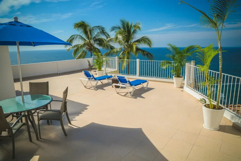 Spacious balcony with ocean view and palm trees by Balcony Construction Christchurch