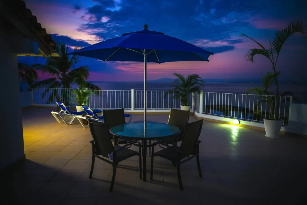 Evening balcony with soft lighting and ocean view by Balcony Construction Christchurch